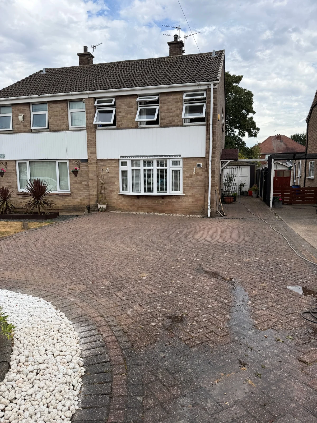 Cleaned block paving driveway in Derby with restored stone and fresh jointing sand